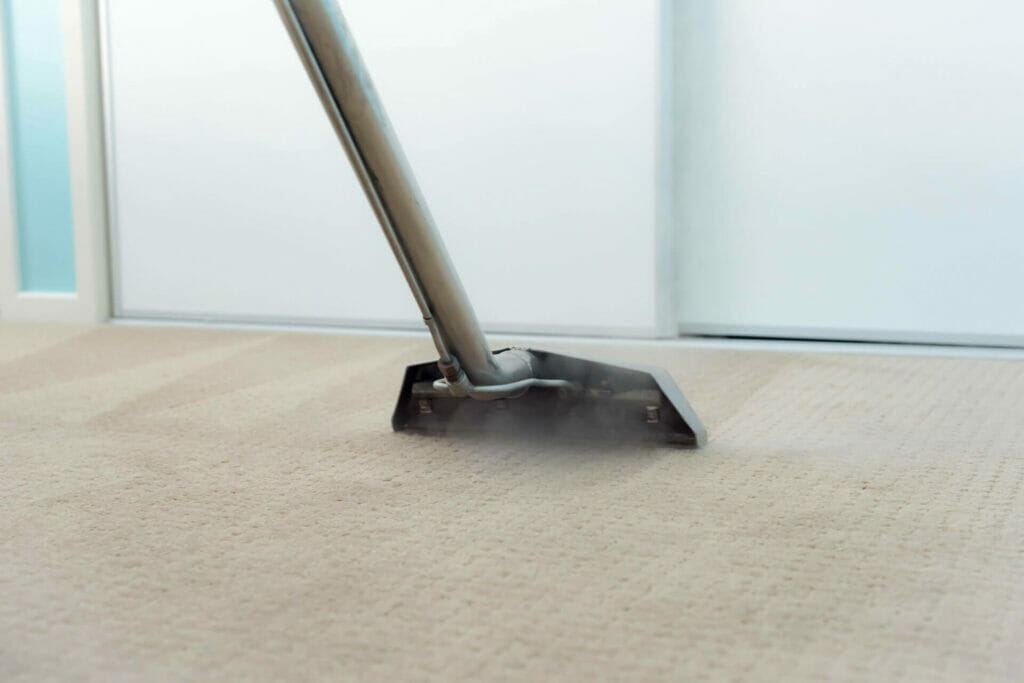 Vacuum cleaning a carpet